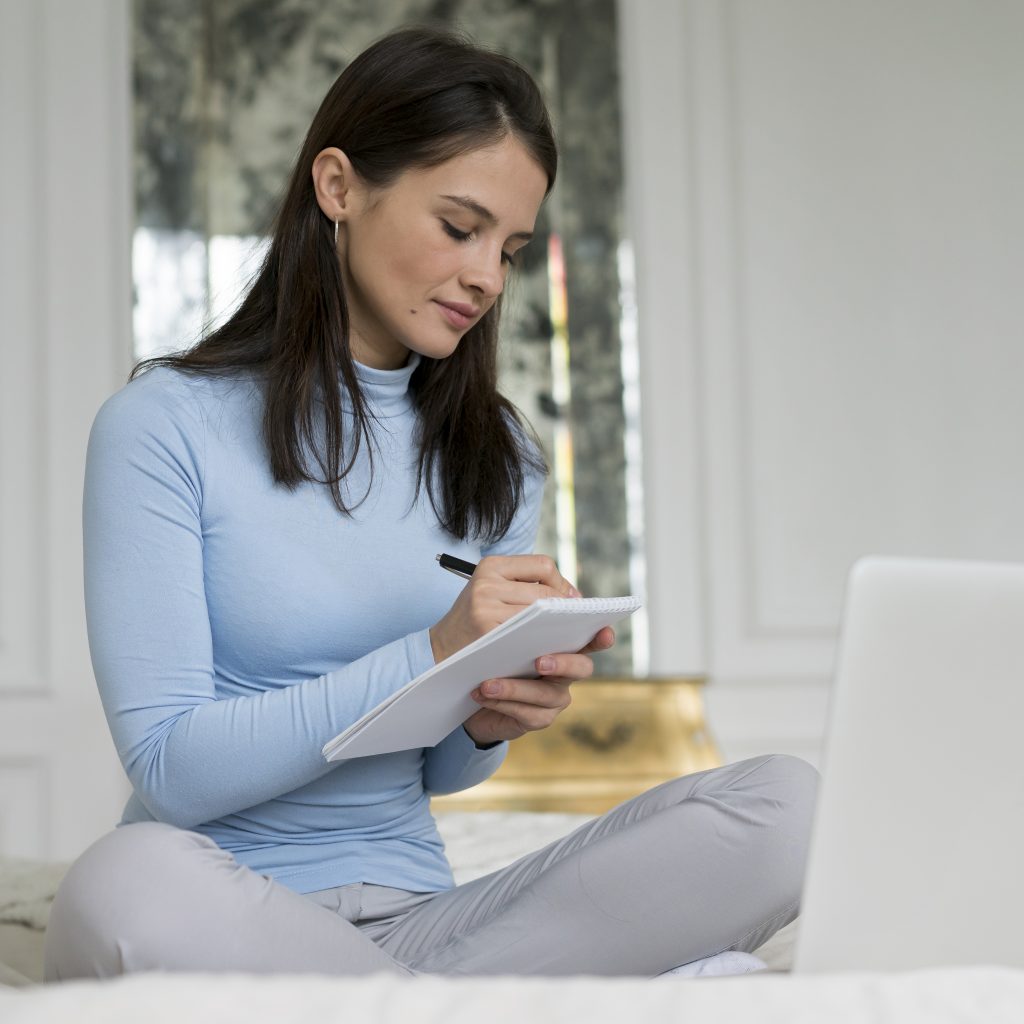 brunette woman having video call home